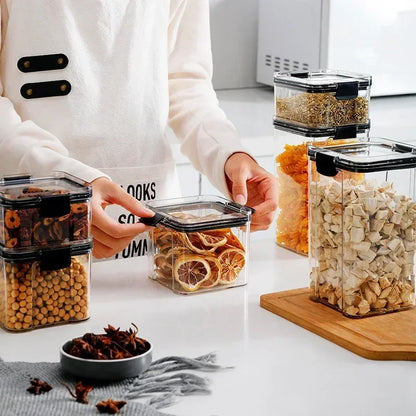 A set of containers of different sizes for storing kitchen supplies.